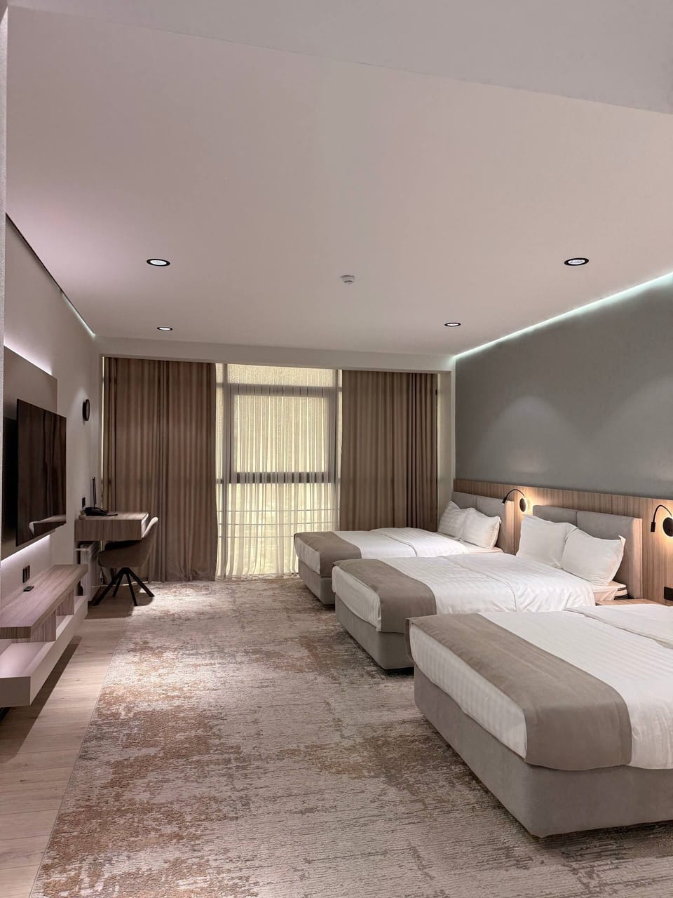 Triple Room, City View | In-room safe, desk, laptop workspace, blackout drapes
