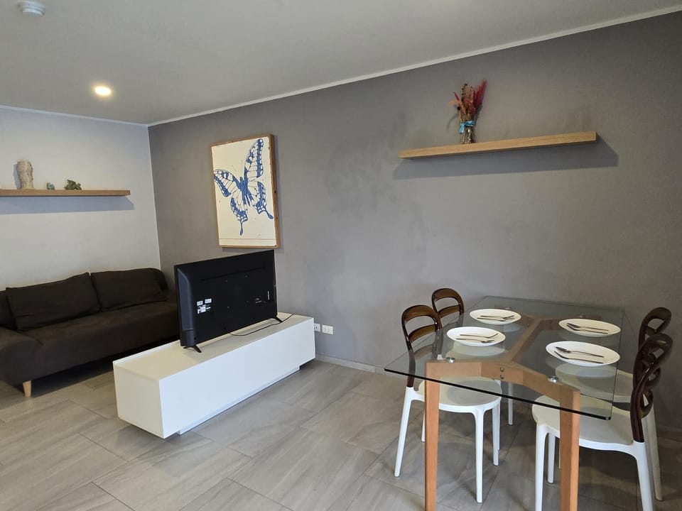 Apartment, Balcony, Mountain View | Living area | Flat-screen TV