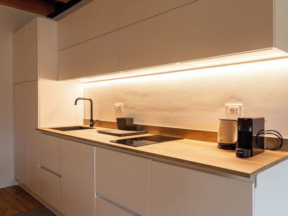 Kitchen, Interior Design, Countertop, Wood, Flooring, Lighting, Kitchen Appliance, Cabinetry, Light Fixture, Ceiling