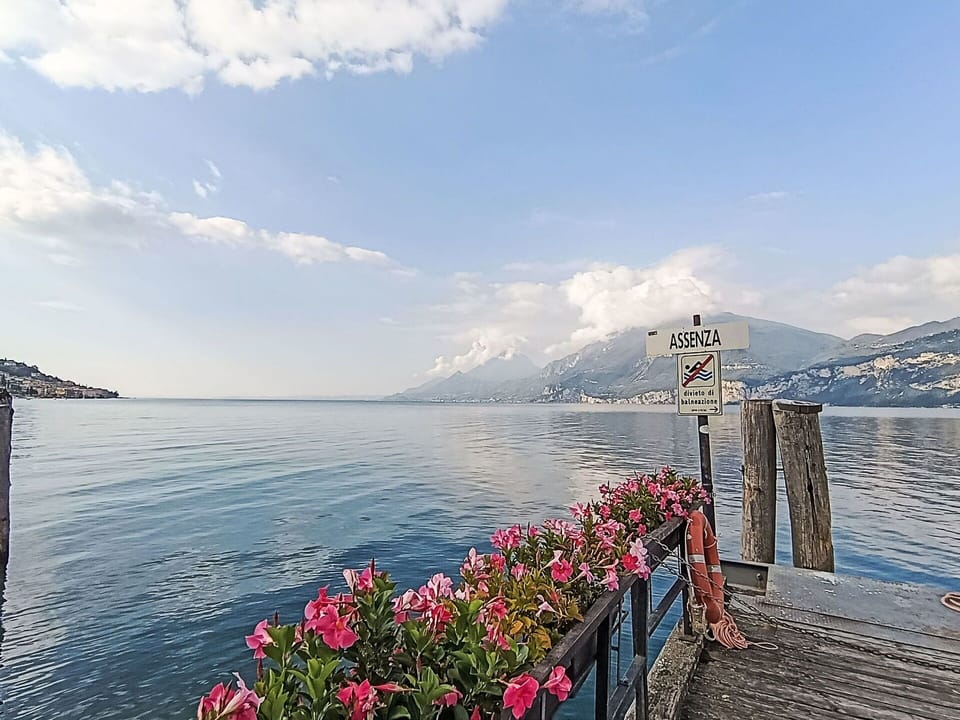 Sky, Mountainous Landforms, Water, Body Of Water, Mountain, Cloud, Mountain Range, Coastal And Oceanic Landforms, Hill, Sea