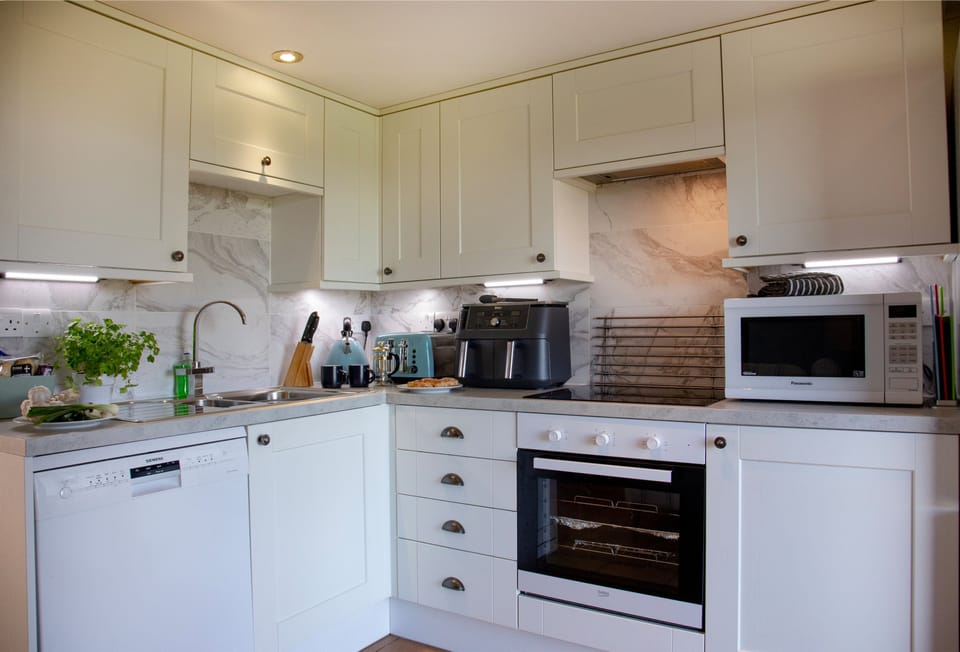 Toad Hall, Bude, Cornwall: First Floor, Bright, open, and effortlessly modern, a kitchen made for holiday living