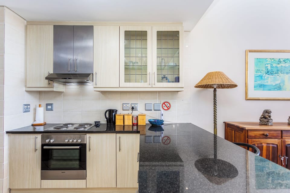 Deluxe Apartment, Balcony, Partial Sea View | Private kitchen | Full-size fridge, microwave, oven, stovetop