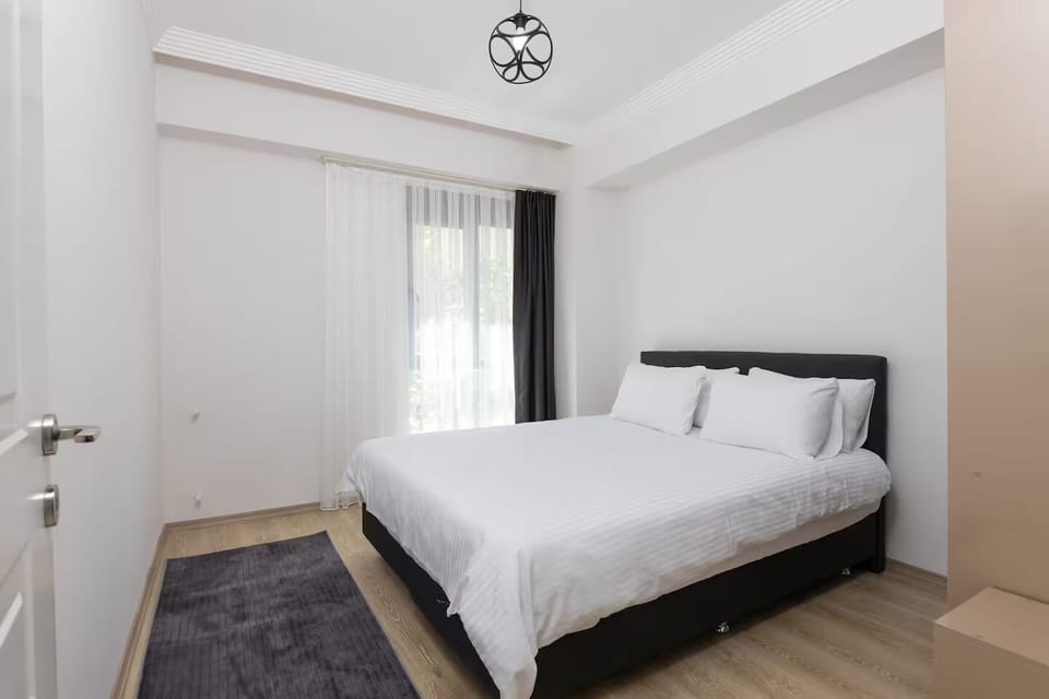 Grand Apartment, 2 Bedrooms | Desk, laptop workspace, blackout drapes, soundproofing