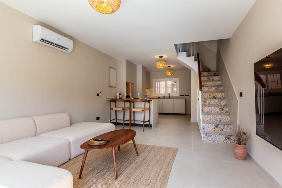 The spacious living room is nice and cozy. 