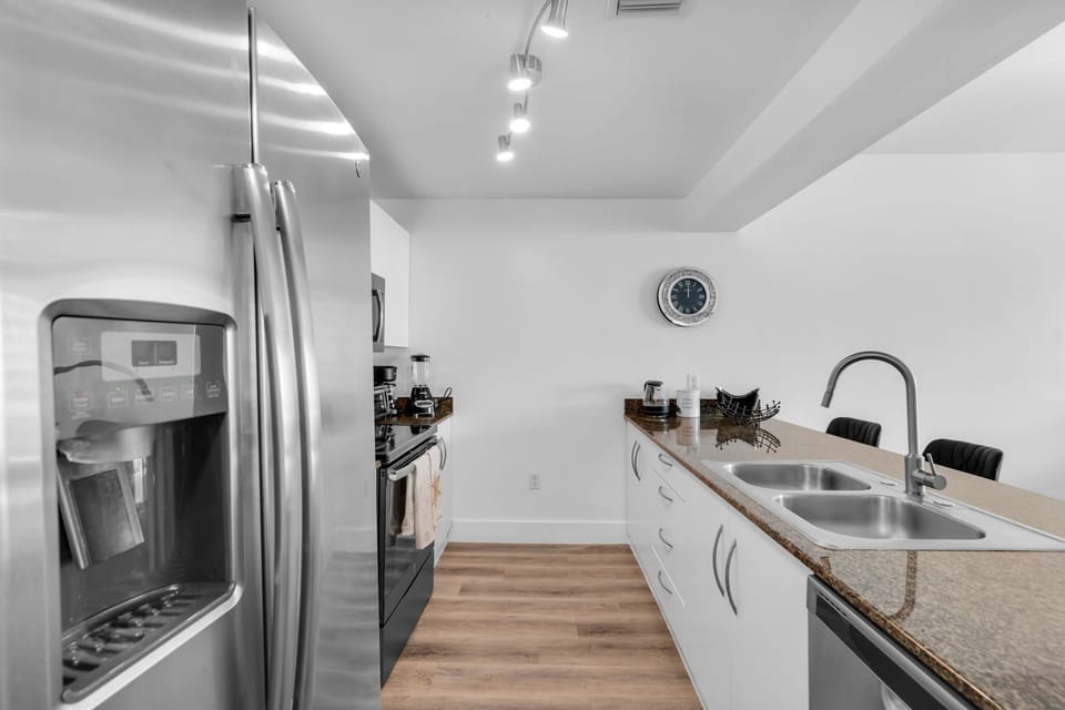 Start your day at the breakfast bar or brew a fresh cup in this fully equipped kitchen—great for extended stays and foodie travelers.