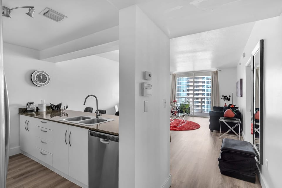 Cook, dine, and unwind in this sleek kitchen and dining space—ideal for long stays, family meals, or remote work setups.