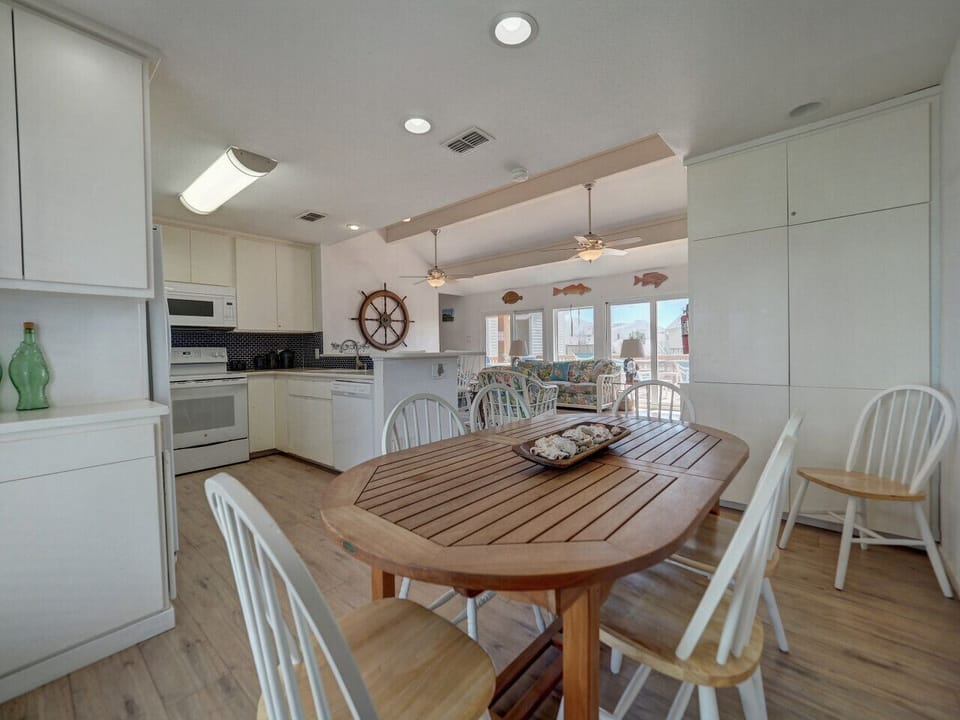 Gather `round for family meals in this sunny dining space.
