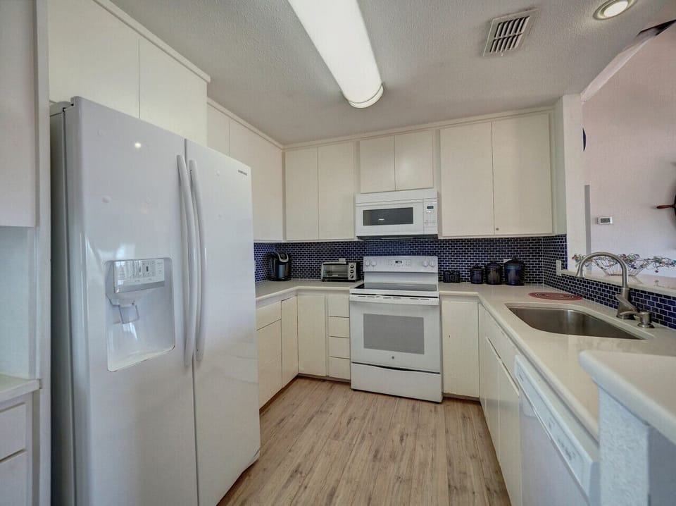 Fully equipped kitchen with everything you need for seaside feasts.
