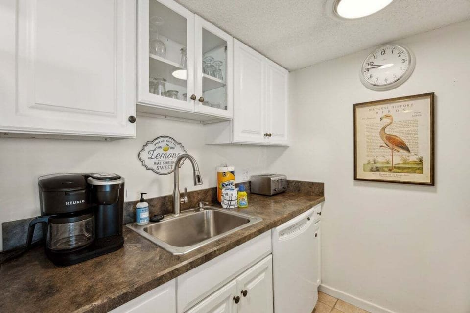 A classic coastal kitchen offering comfort and convenience, perfect for preparing beachside breakfasts or evening dinners in.