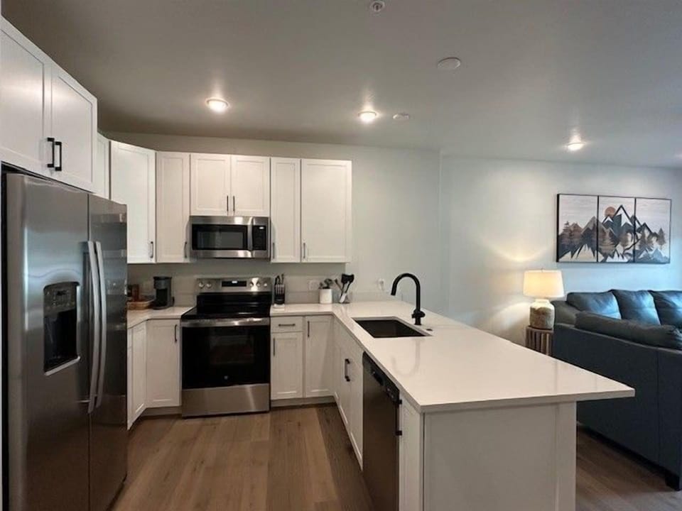 Whip up delicious meals in the modern kitchen with stainless steel appliances and spacious island.