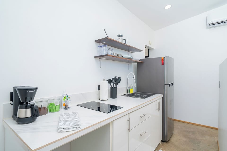 Full-size fridge, stovetop, coffee/tea maker, electric kettle