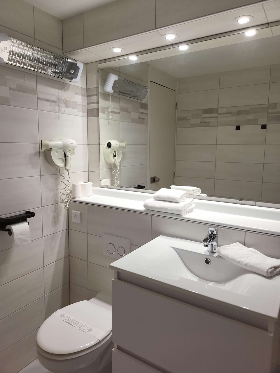 Eco-friendly toiletries, hair dryer, towels, soap