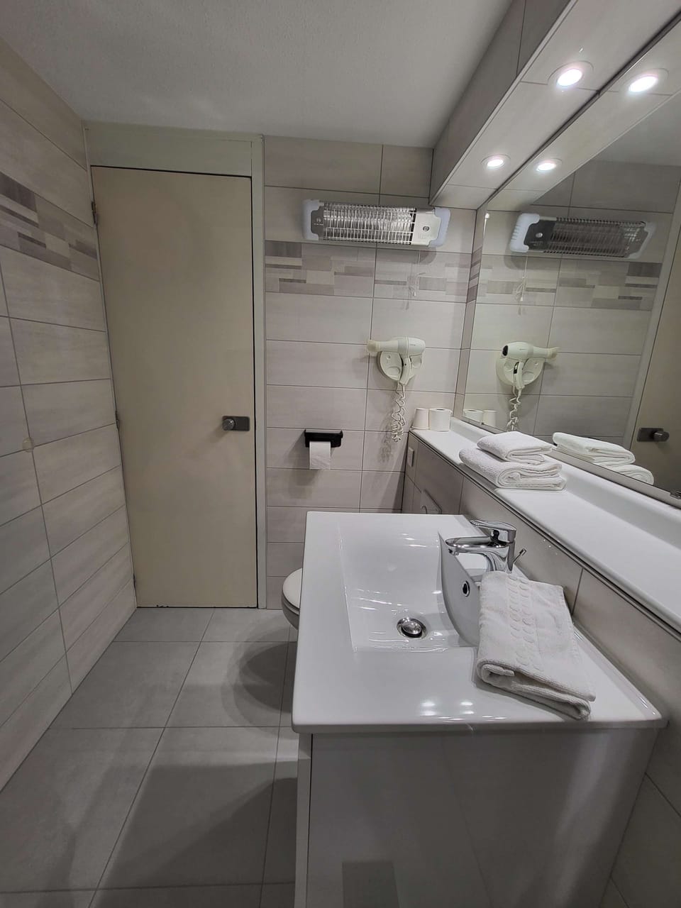 Eco-friendly toiletries, hair dryer, towels, soap