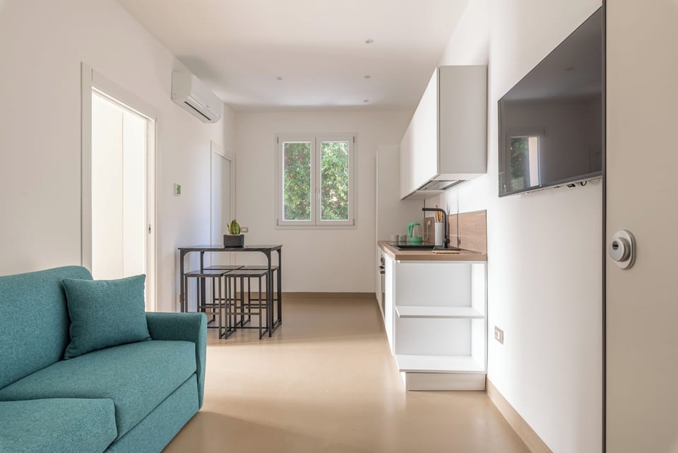 Apartment, 1 Bedroom | Living area | 30-inch TV with satellite channels