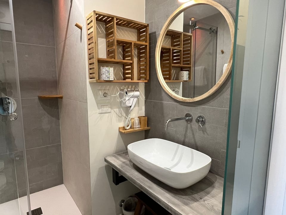Shower, eco-friendly toiletries, hair dryer, slippers