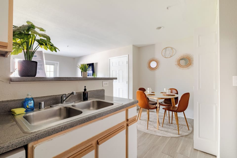 Bright kitchen with open pass-through and cozy modern dining nook