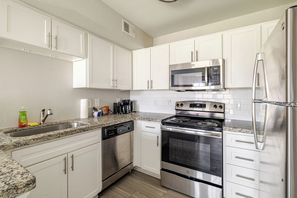 Bright modern kitchen with stainless appliances and ample counter space