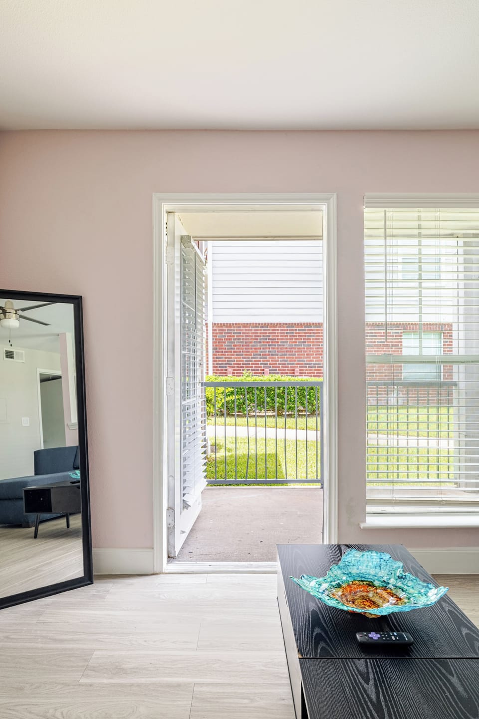 Bright living space with natural light and easy patio access