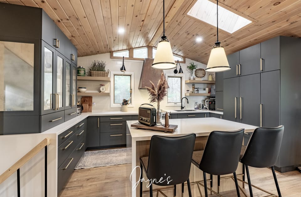 Modern kitchen with sleek cabinetry and cozy breakfast bar seating