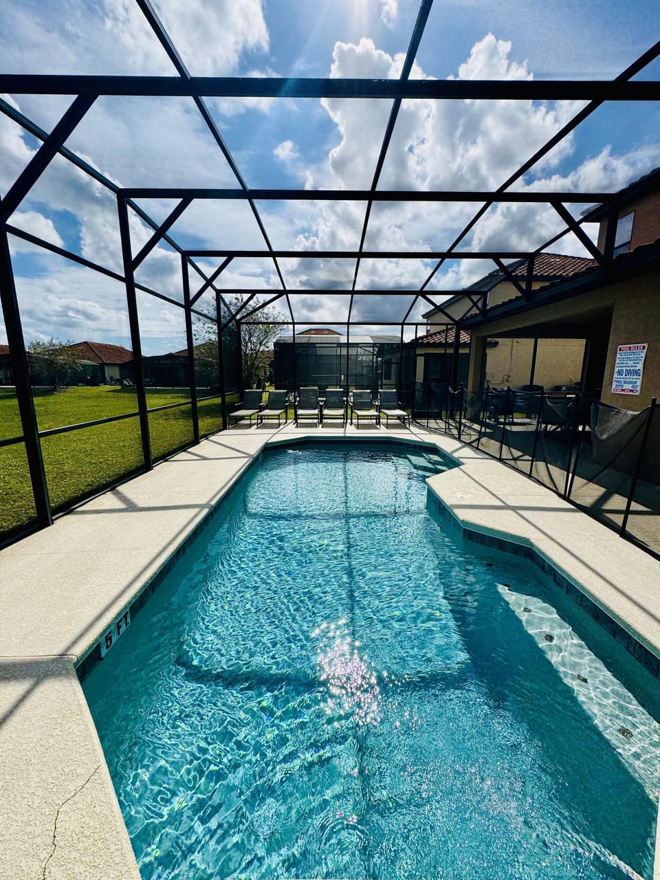 Sunlit screened pool area perfect for relaxing and fun