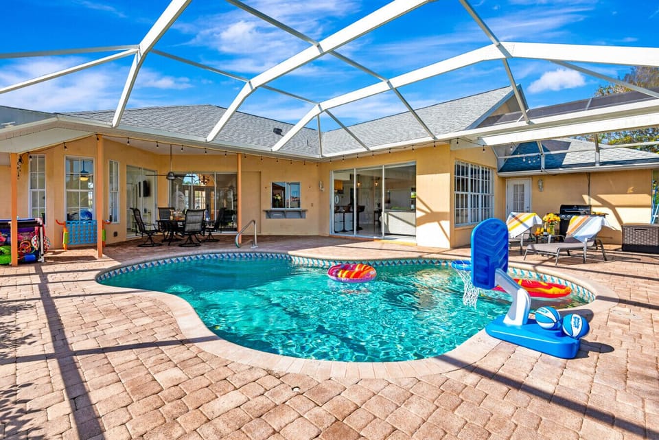 Screened Pool Area | Private Heated Pool with Lounge Chairs and Games | Perfect for Relaxing and Entertaining
