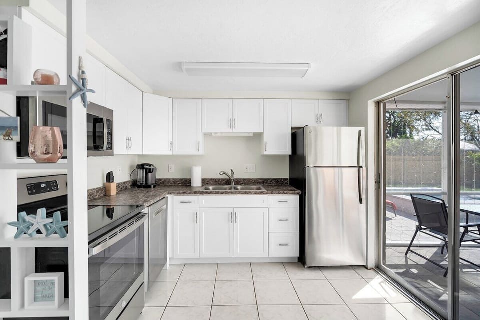 The lanai area is right off the kitchen providing great views of the pool!
