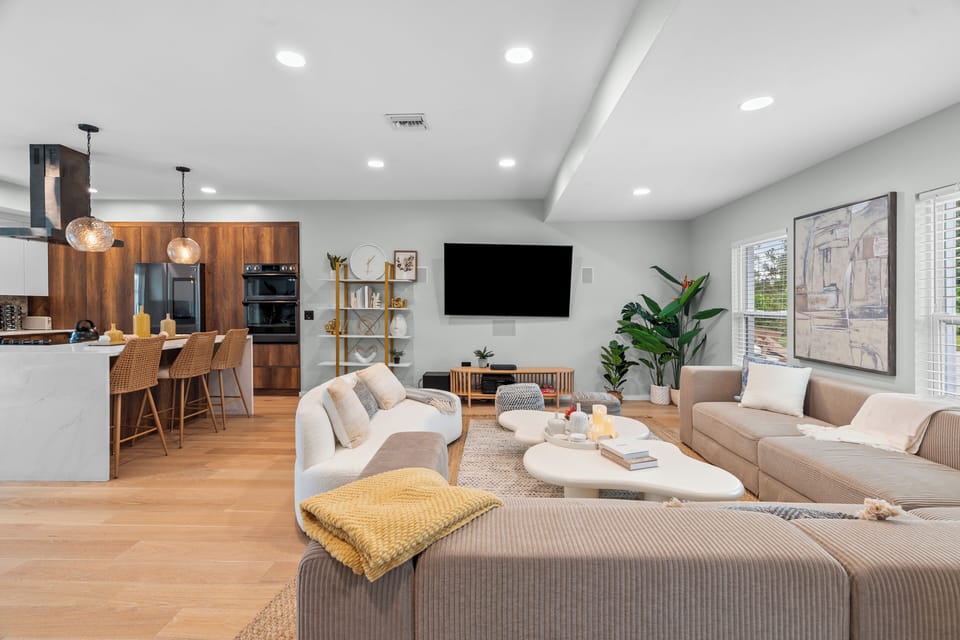 Fully stocked kitchen with island and bar seating and L-shaped sectional