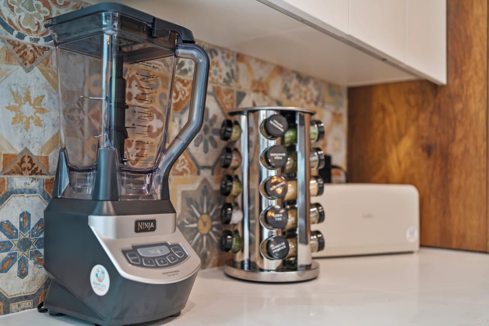 Ninja blender and coffee pod carousel – smoothies ready.