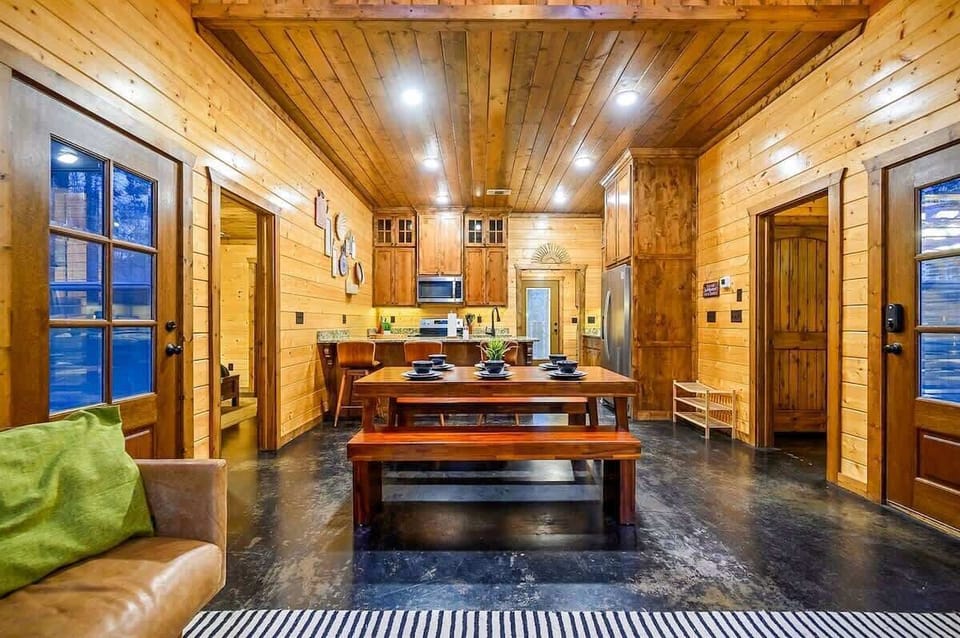 Bright, open layout with a rustic wood dining table perfect for shared moments.