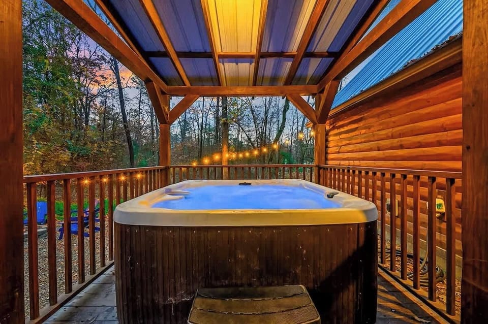 Unwind under the stars in the private covered hot tub—perfect after a day of Hochatown adventures.