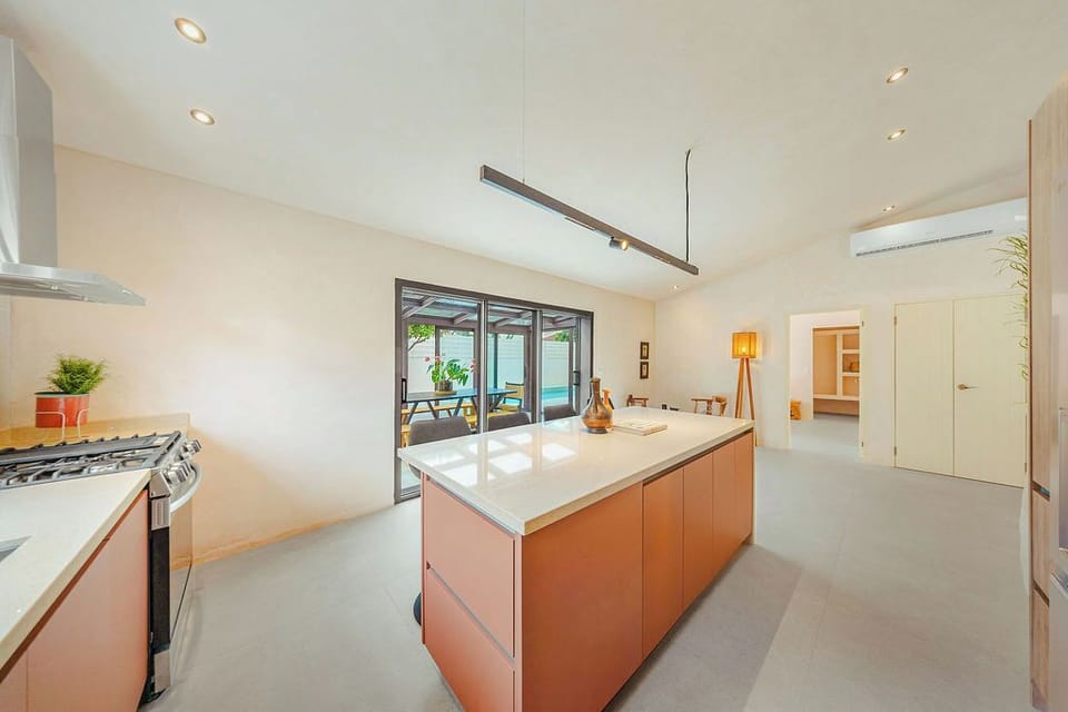 This open-concept space makes entertaining a breeze, blending our sleek, fully-equipped kitchen with a spacious outdoor patio dining area. Prep your favorite meal, grab a drink at the island, and effortlessly transition to al fresco relaxation!