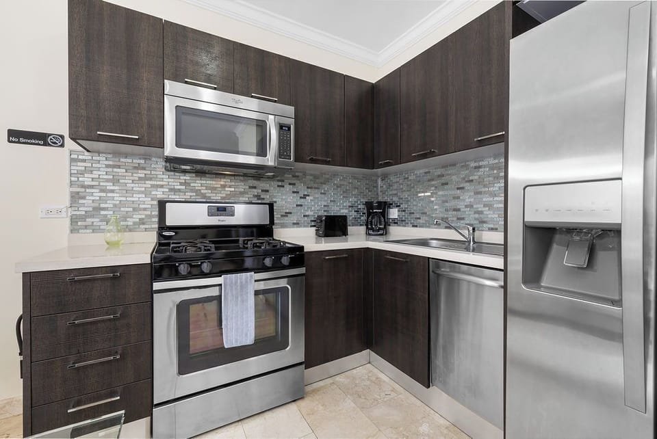 A kitchen that feels like home. This fully equipped, modern kitchen features full-size stainless steel appliances, a gas range, and everything you need to cook up a gourmet meal. Enjoy the convenience of a true home away from home.