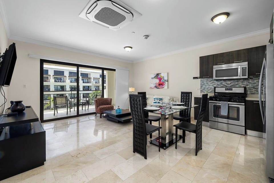 This open-concept design is perfect for gathering, cooking, and relaxing. From the fully equipped kitchen to the sleek glass dining table and the bright living room leading to your private balcony, every detail is designed for comfort and connection.