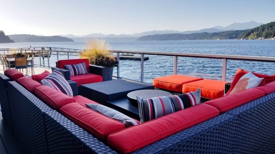 Vacation Rental hood canal resort walls of glass beach rental deck outdoor sofa