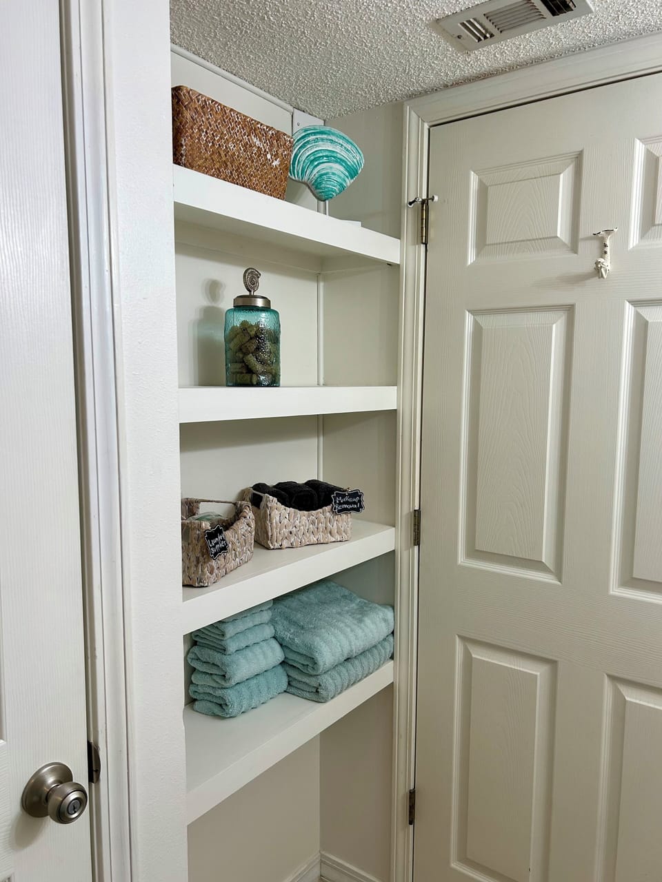 New wood shelves in hall bathroom, perfect for holding your toiletries.