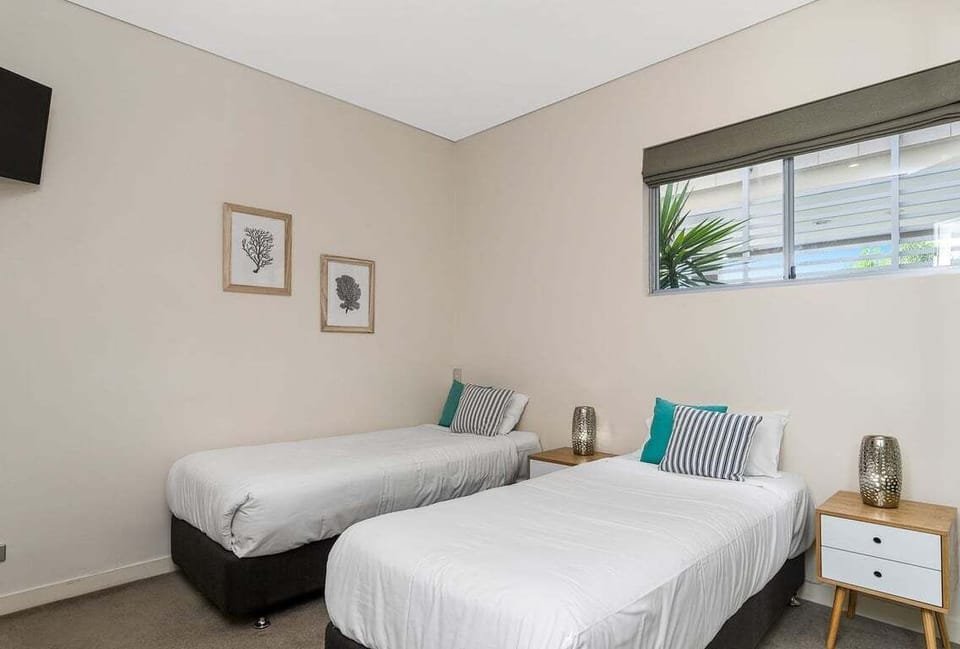 A bright and cozy twin room perfect for friends, siblings, or kids to unwind comfortably.