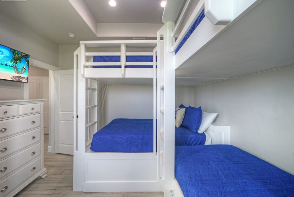 Bedroom 3 features twin bunk beds and a trundle with access to the shared bathroom.