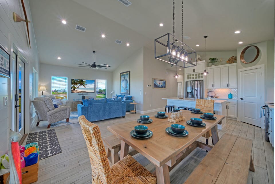 Open-concept dining and living area with seating for eight.