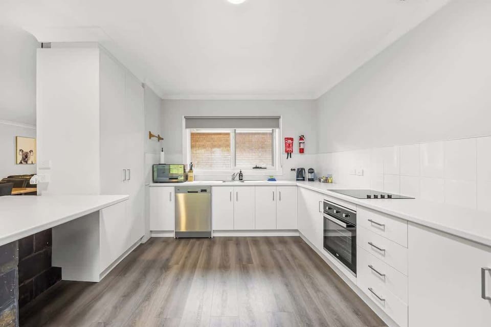 A large, well-equipped kitchen designed for shared meals