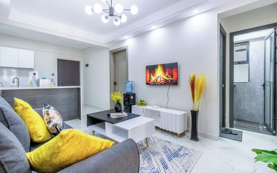Standard Apartment | Living area | 43-inch flat-screen TV with digital channels