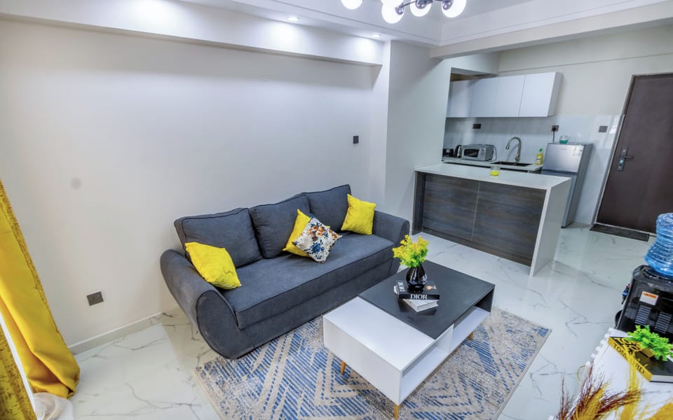 Standard Apartment | Living area | 43-inch flat-screen TV with digital channels