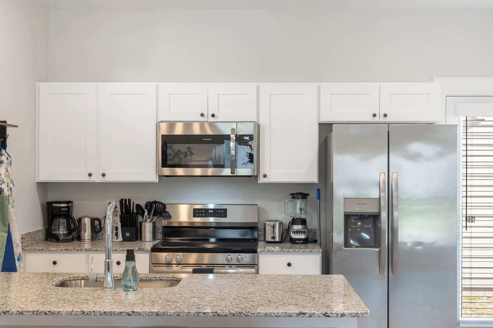 Kitchen is fully appointed and ready to cook. 
