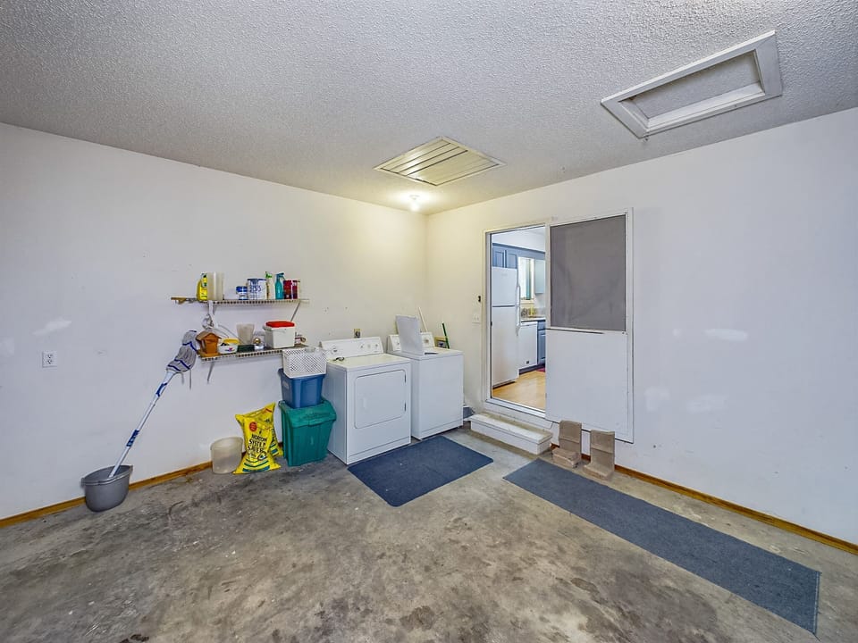 Washer and dryer in garage.