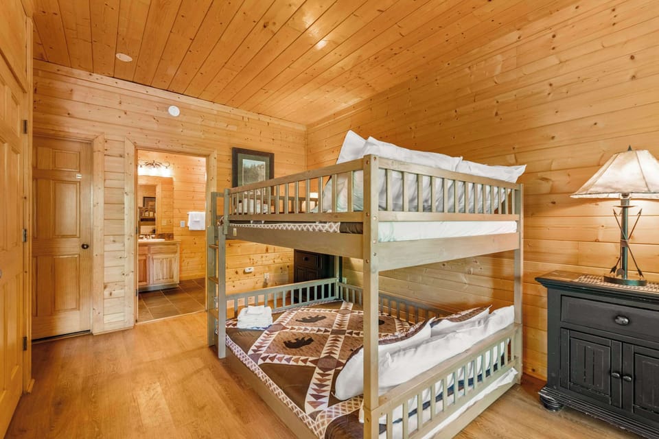Game room with pool table, TV, and Queen bunk bed.