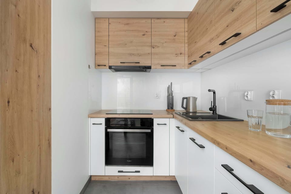 The stylish kitchen with wooden accents and modern appliances makes it easy to prepare your favorite meals.