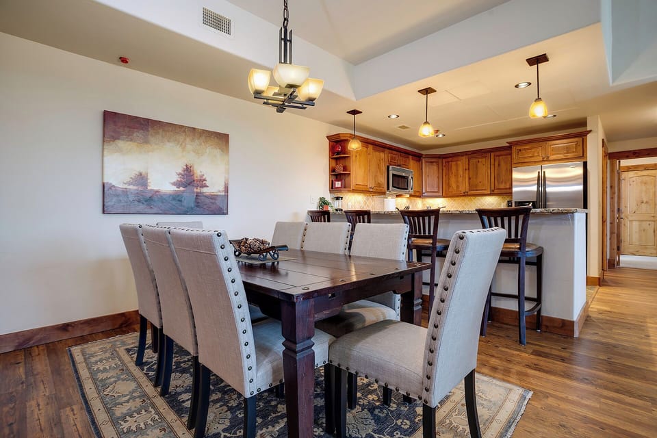Gather around your elegant dining table for memorable meals, with a gourmet kitchen and stylish bar seating just steps away.