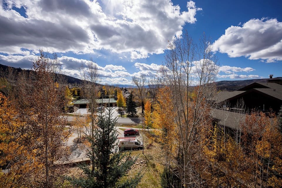 Stunning autumn views surround the property with golden foliage and mountain vistas creating a picturesque seasonal retreat.