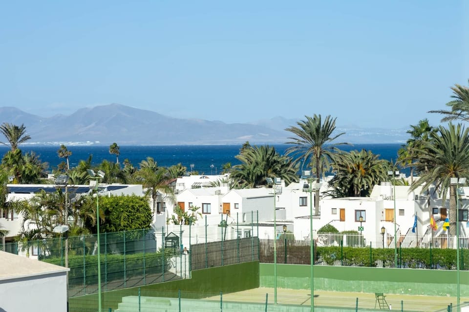 Sea view: Corralejo in the front and the neighbouring island of Lanzarote in the background