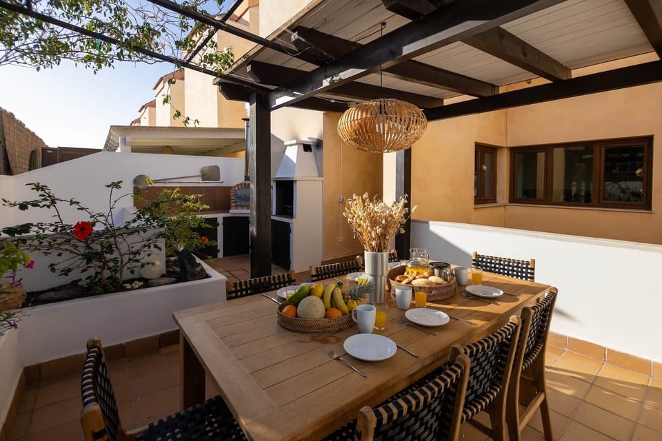 Terrace with dining area, barbeque and pizza oven at your holiday villa Fuerteventura