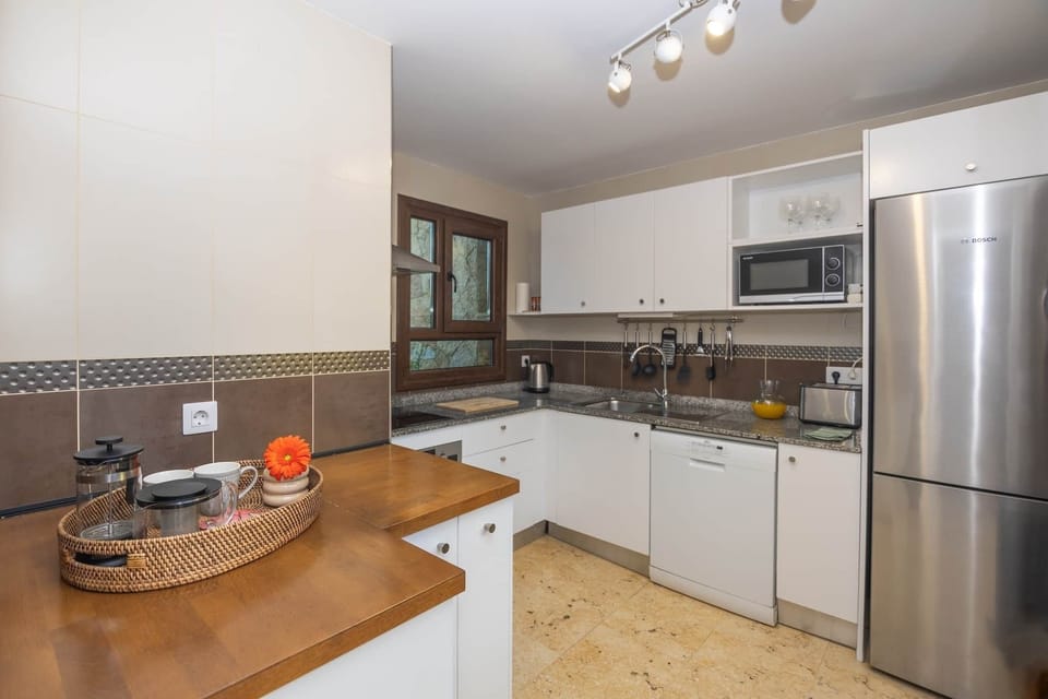 Large and fully equipped kitchen overlooking both terraces
